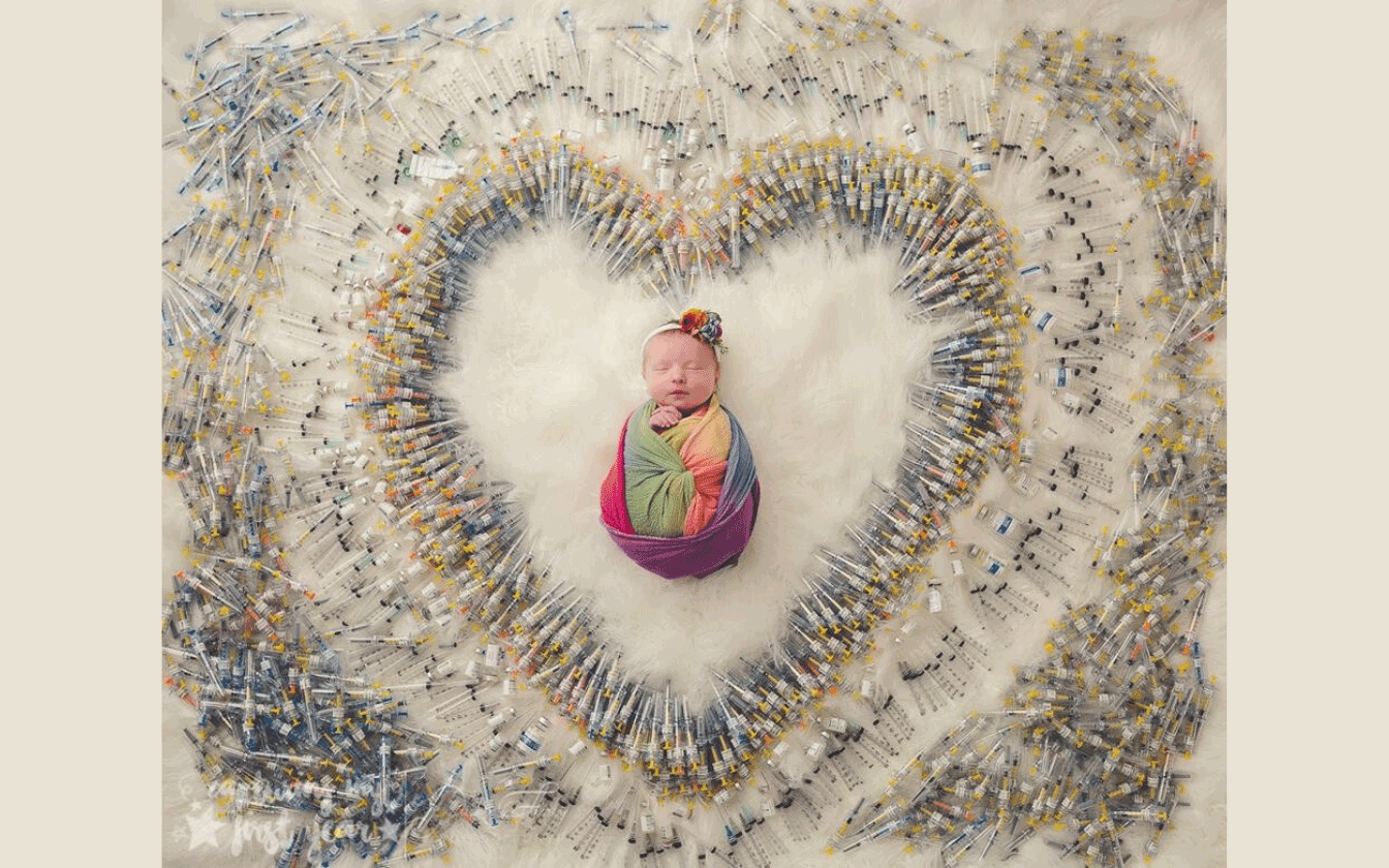 Baby Pictured with the 1616 IVF Needles Used To Make Her!