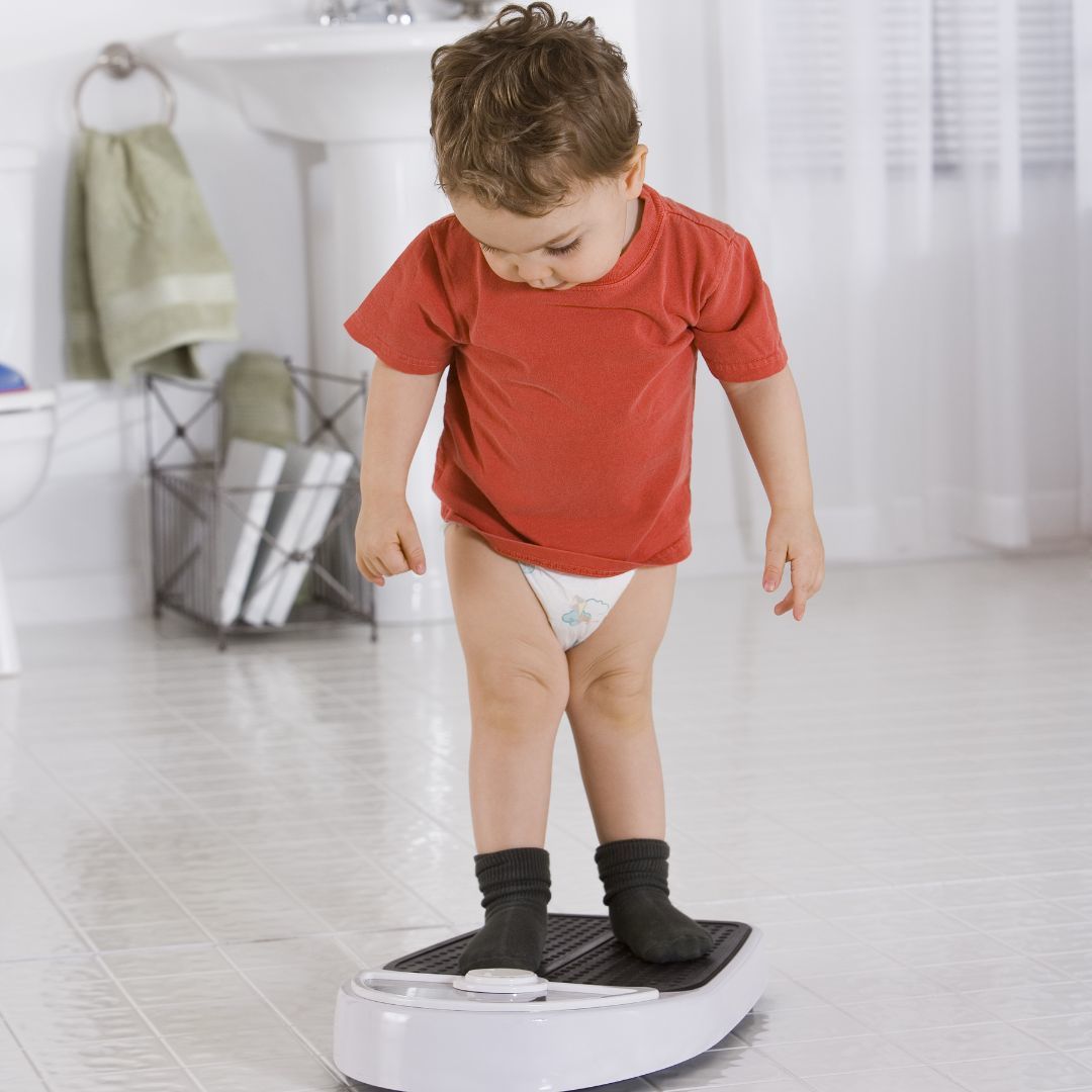 child-being-weighed